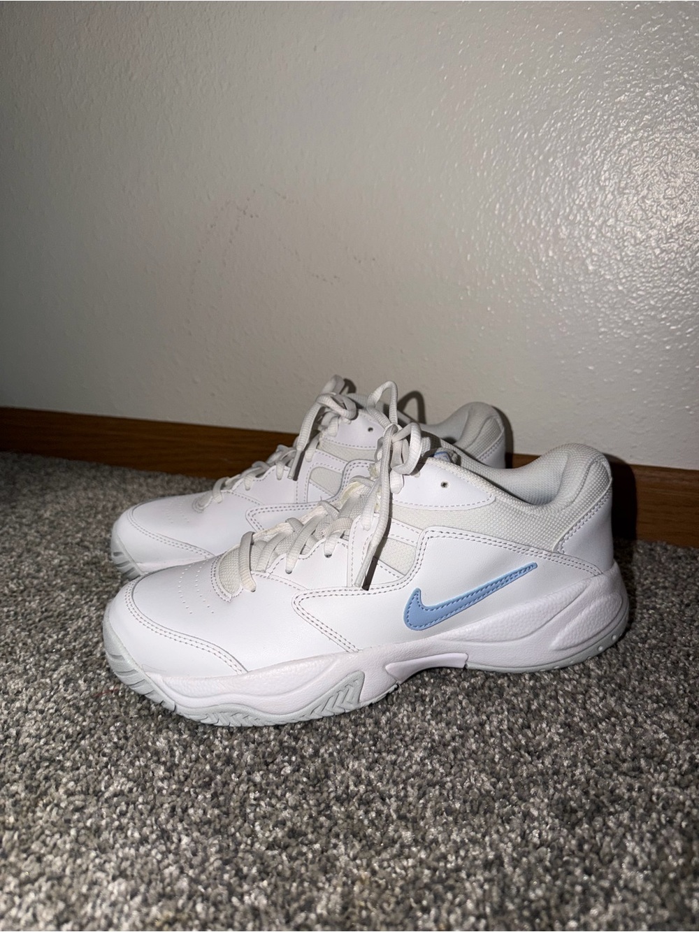 Nike White Sneakers with Pale Blue Swoosh Accent